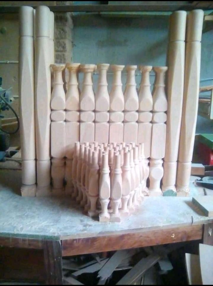 Set of turned wooden newel posts, balusters and spindles in the workshop
